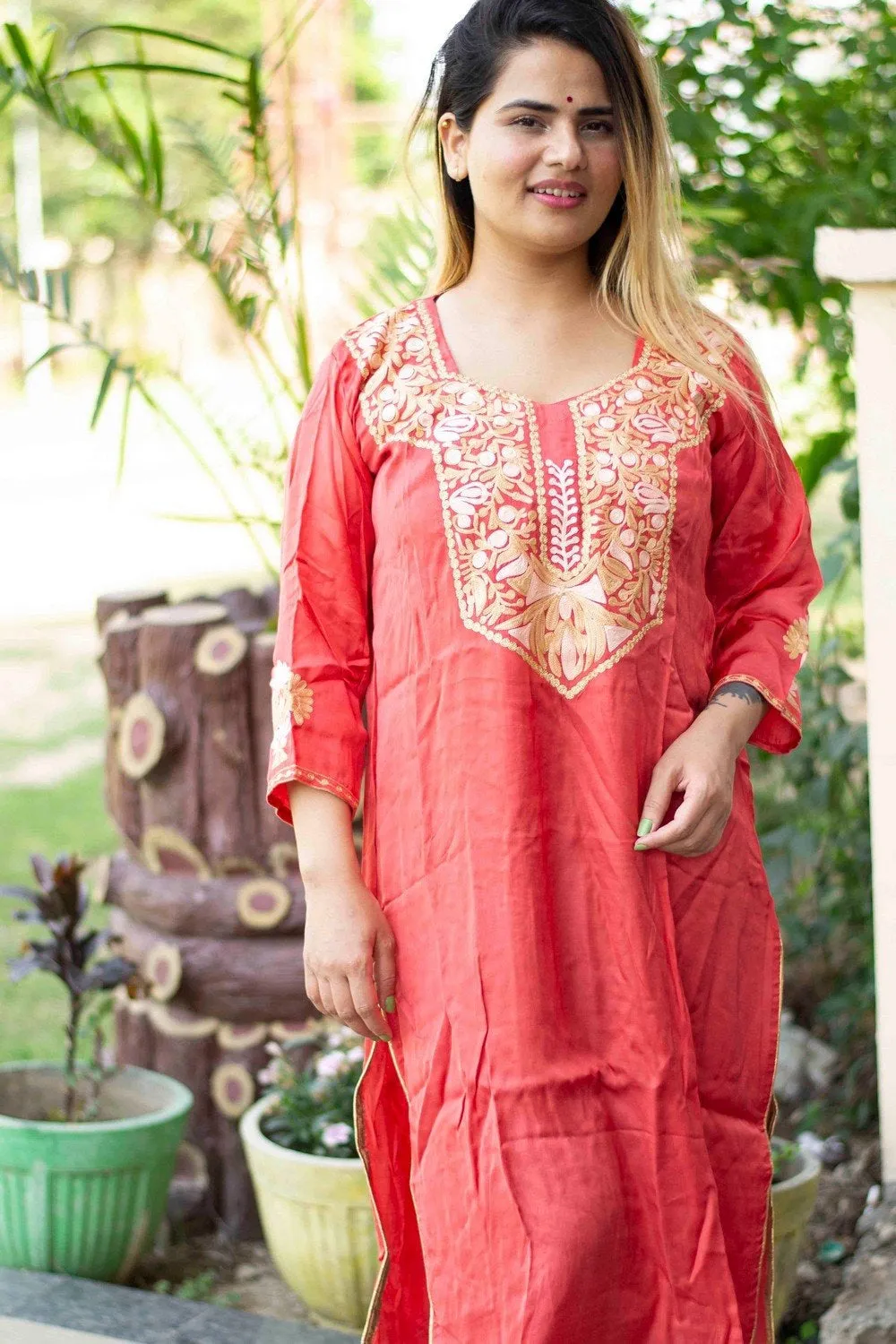 Carrot Colour Cotton Kurti With Beautiful Aari Embroidery Gives Attractive Look To The Wearer.